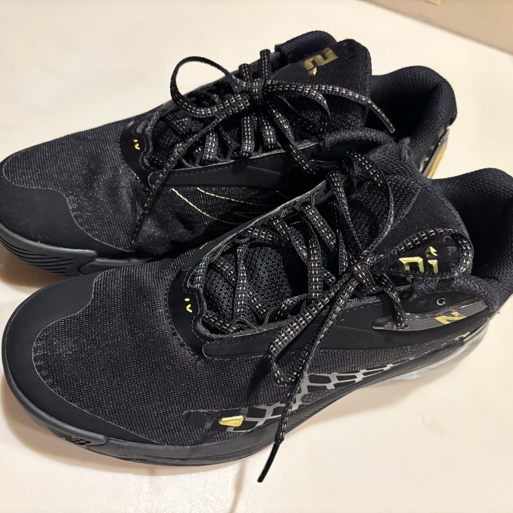 Kawhi Leonard Newbalance Black and Gold basketball shoes